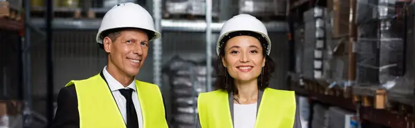 Professional headshot banner, middle aged supervisor and female employee in hard hat with clipboard — Stock Photo