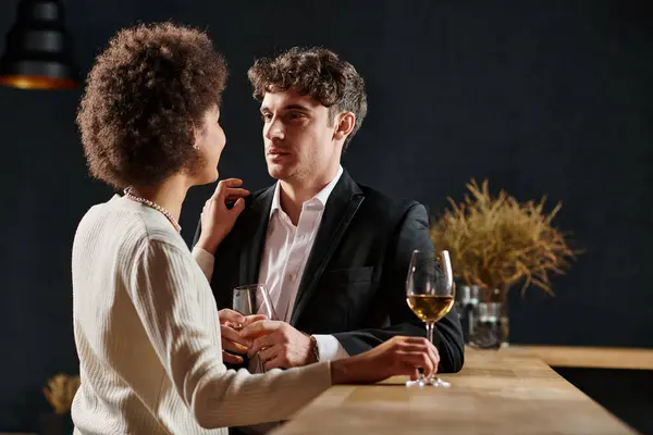 Handsome man looking at african american girlfriend during date on valentines day, romance — Stock Photo