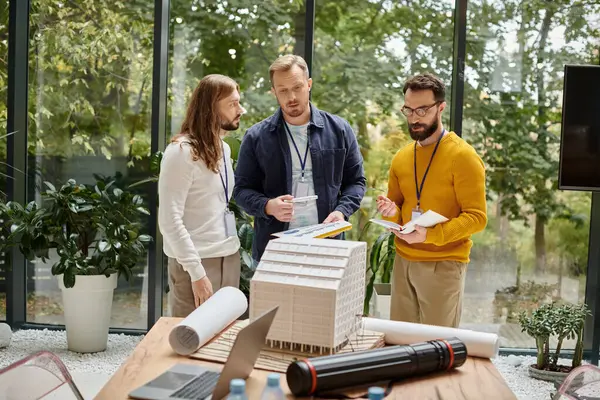 Concentrated attractive coworkers in comfy attires working together on their startup while in office — Stock Photo