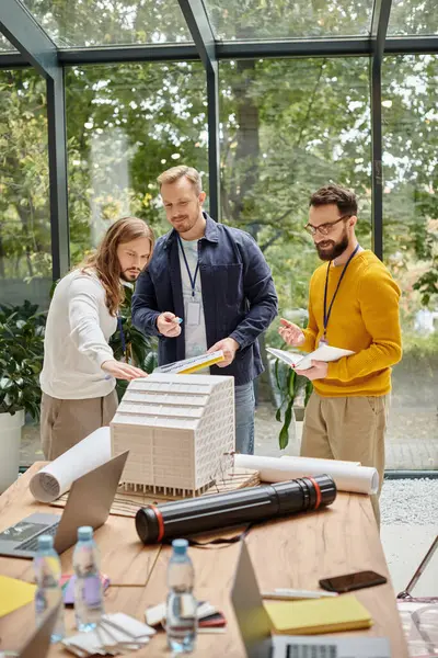 Joyful handsome architects in casual outfits working together on their startup, coworking concept — Stock Photo