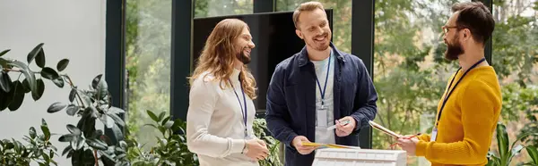 Happy attractive architects in casual outfits working together on their startup, coworking, banner — Stock Photo