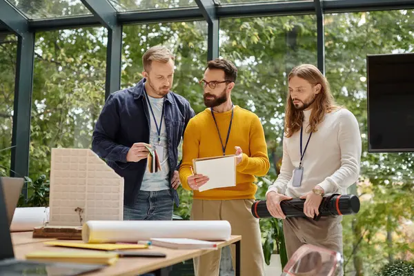 Concentrated appealing colleagues in casual attires working together on their startup, business — Stock Photo