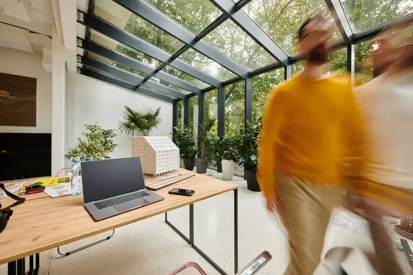 Long exposure photo of dedicated smart coworkers moving around their office, startup, motion blur — Stock Photo