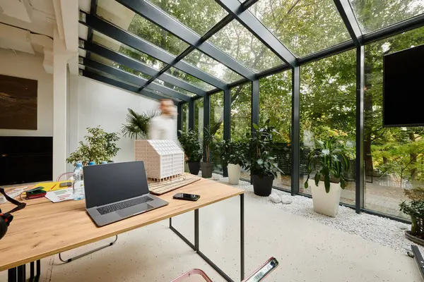 Long exposure picture of dedicated coworkers moving around their office, startup, motion blur — Stock Photo