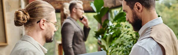 Handsome focused businessmen in elegant outfits discussing their project in their office, banner — Stock Photo