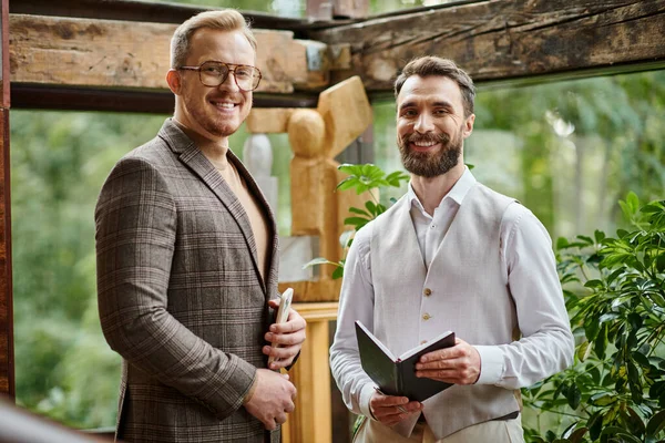 Happy attractive business leaders with glasses in fashionable attires discussing their startup — Stock Photo