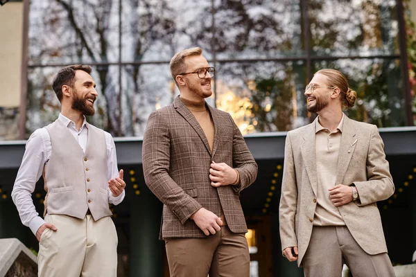 Joyful handsome business leaders with glasses in fashionable attires discussing their startup — Stock Photo