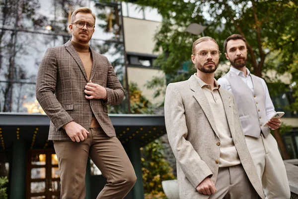 Concentrated attractive business leaders in elegant attires posing together while working hard — Stock Photo