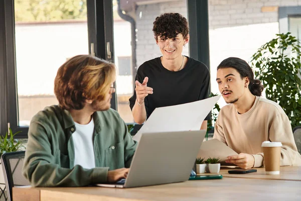 Team of young entrepreneurs in their 20s engaged in project planning in bright office, startup — Stock Photo