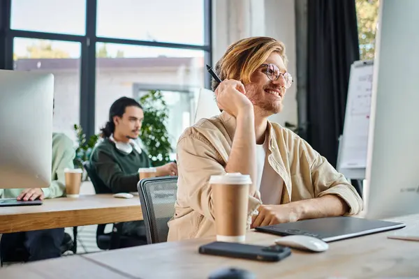 Happy man working on creative project and looking at monitor in coworking, retouching team — Stock Photo