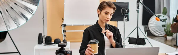 Appealing female designer in casual attire working with her drawing tablet in studio, banner — Stock Photo