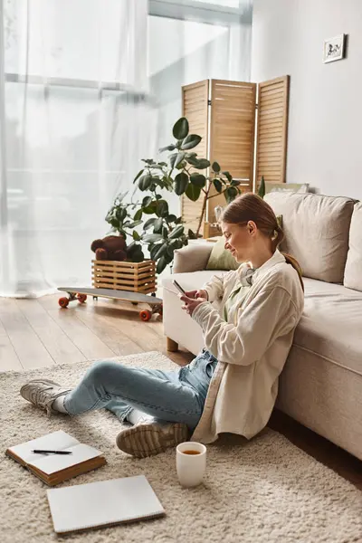 Teenage girl absorbed in social media on her smartphone at home, generation z lifestyle — Stock Photo