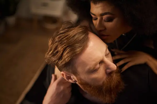 Passionate night of diverse couple at home, curly african american woman kissing tattooed man — Stock Photo