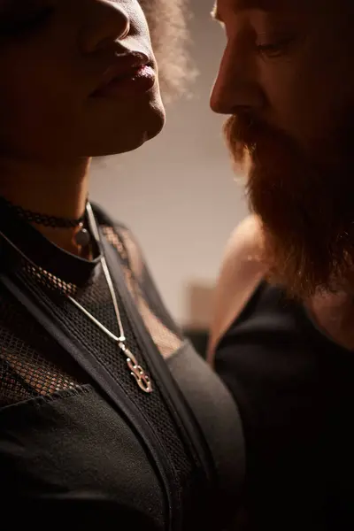 Close up of bearded redhead man seducing african american woman in bedroom, passion and desire — Stock Photo