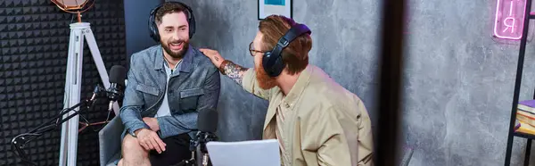 Hard working bearded interviewer discussing main questions with his guest during podcast, banner — Stock Photo