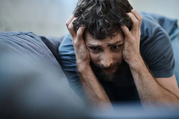 Desperate man with beard screaming with hand on his face during breakdown, mental health awareness — Stock Photo