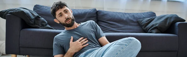 Anxious traumatized man in home wear having severe panic attack, mental health awareness, banner — Stock Photo