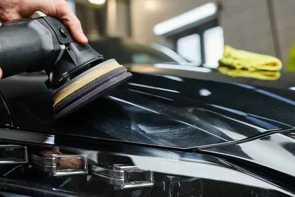 Cropped view of devoted professional worker working with polishing machine carefully in garage — Stock Photo