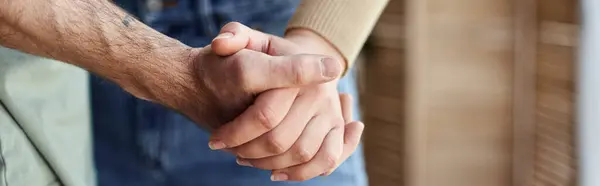 Cropped view closeup image of couple in love holding hands. Symbol sign sincere feelings, banner — Stock Photo