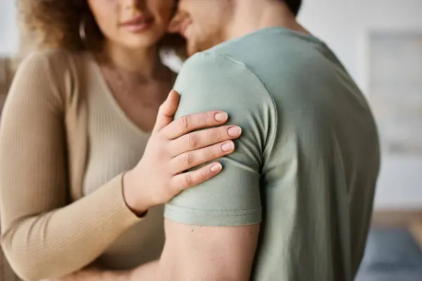 Cropped image of couple in love, woman touching shoulder of her boyfriend at home — Stock Photo