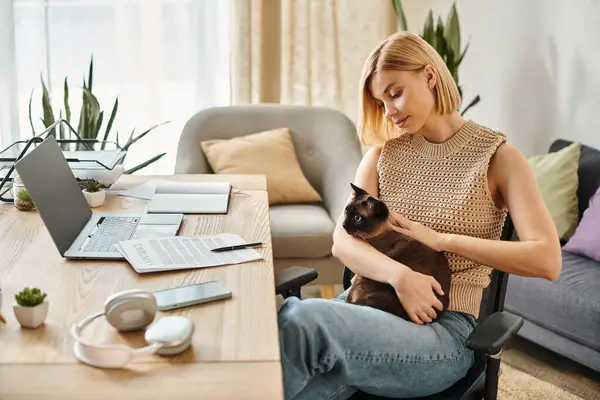 A woman with short hair sits peacefully in a chair, holding and bonding with her beloved cat at home. — Stock Photo