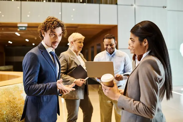 Diverse group of business professionals collaborating and discussing ideas. — Stock Photo
