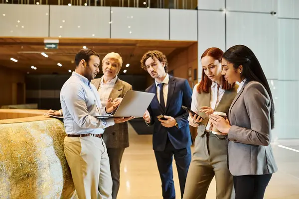 Diverse business team standing in a circle discussing strategies. — Stock Photo