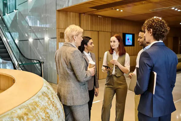 Multicultural business colleagues standing in circle, having a discussion. — Stock Photo