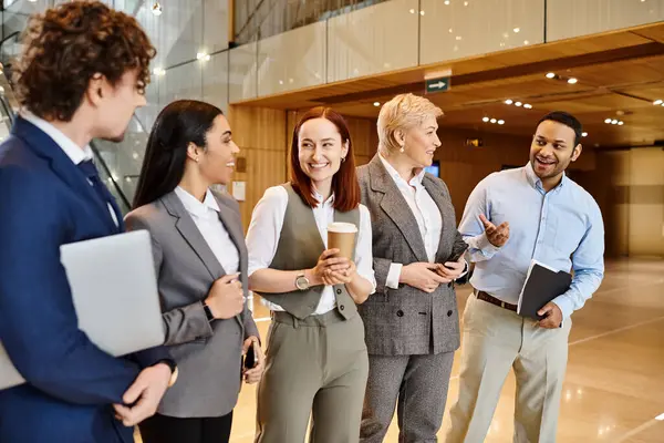 Multicultural business professionals gather in a lobby for a meeting. — Stock Photo