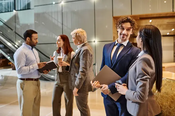 Multicultural group of business professionals collaborating and discussing ideas. — Stock Photo