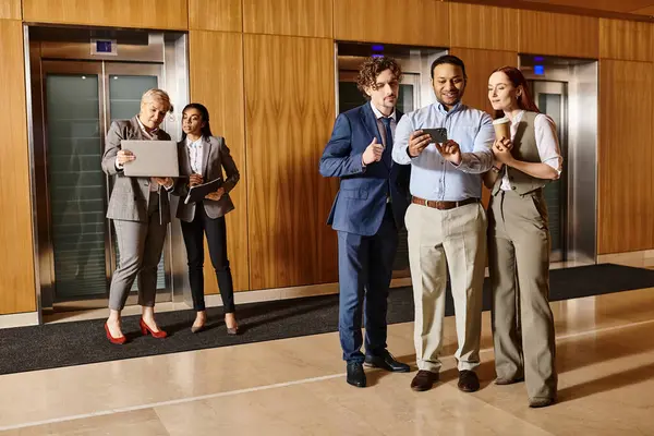 Multicultural group of business people standing together in elevator. — Stock Photo