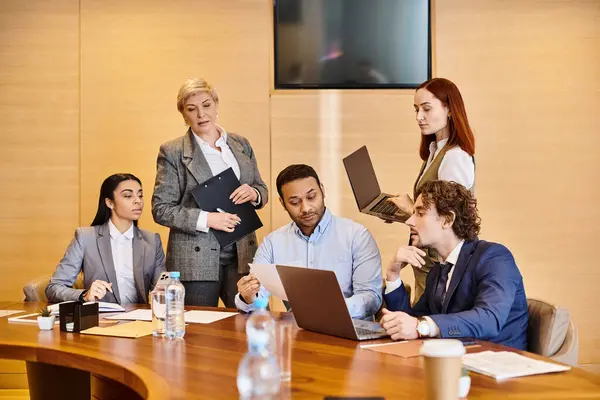 Multicultural business professionals brainstorming at office meeting. — Stock Photo