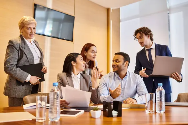 Multicultural professionals collaborating around a conference table. — Stock Photo