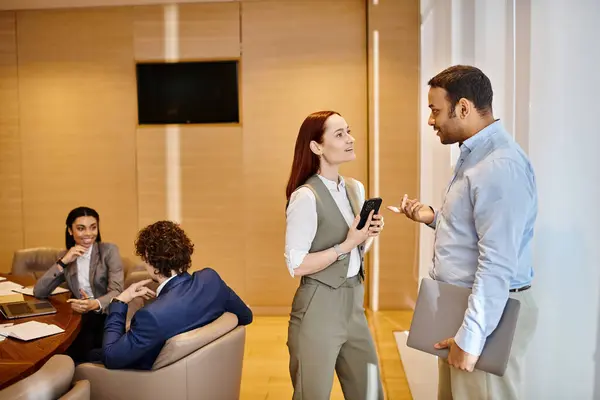 Multicultural professionals engage in a meeting inside a conference room. — Stock Photo