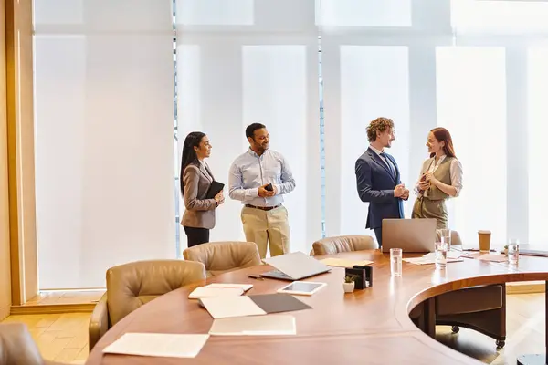 Multicultural professionals collaborating around a conference table. — Stock Photo
