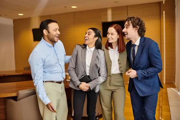 Diverse business professionals standing shoulder to shoulder in a room. — Stock Photo