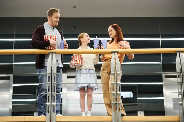 Family enjoys a breathtaking view while standing together on a balcony, united in the moment. — Stock Photo
