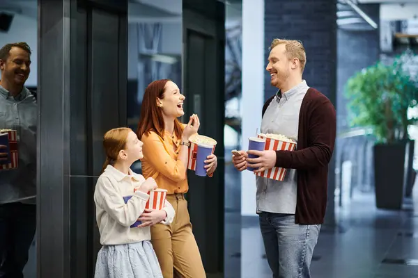 A happy family stands closely together, forming a tight circle of love and unity. — Stock Photo