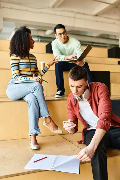 Multicultural group of students, including African American girl, attentively sitting in lecture hall at university — Stock Photo