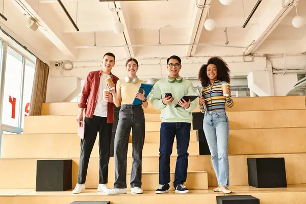 Multicultural students, including an African American girl, standing on top of a grand staircase indoors — Stock Photo