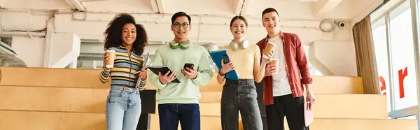 A diverse group of students, including an African American girl, standing together with smiles in an educational setting — Stock Photo