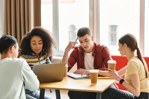 A diverse group of students engaged in a lively discussion around a table, showcasing multiculturalism and unity in education. — Stock Photo