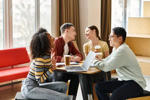 A diverse group of students from different ethnic backgrounds engaging in a lively discussion around a table. — Stock Photo