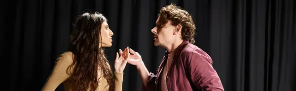 A man and woman stand next to each other during a theatrical rehearsal. — Stock Photo