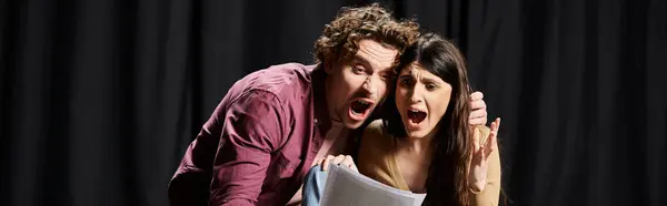 Handsome man and woman pose for cameras during theater rehearsals. — Stock Photo
