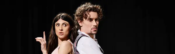A good-looking man and woman stand side by side during theater rehearsals. — Stock Photo