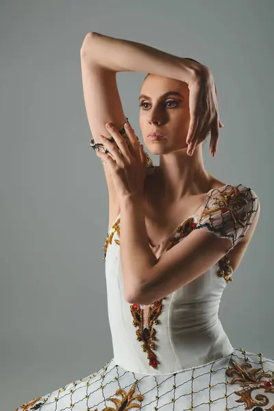 Graceful dancer in white dress striking a pose. — Stock Photo
