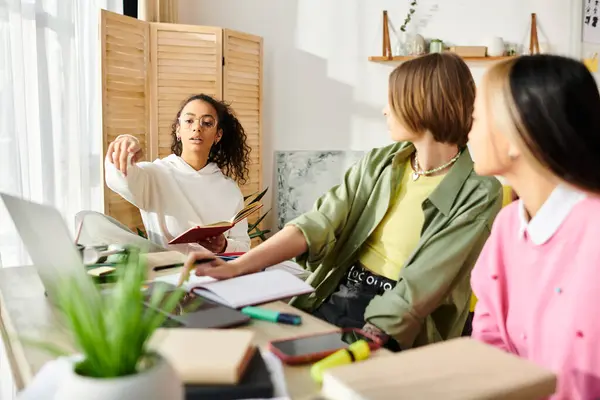Diverse group of teenage girls engaged in a study session, showcasing friendship and dedication to education. — Stock Photo