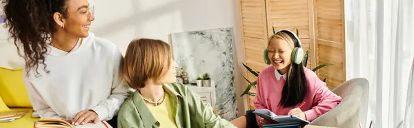Diverse teenage girls engage in a study session at home, showcasing unity, friendship, and dedication to education. — Stock Photo