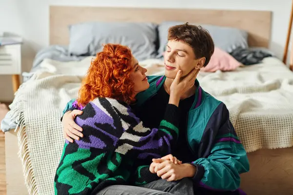 Young joyous couple in vibrant clothing spending time together and hugging each other lovingly — Stock Photo